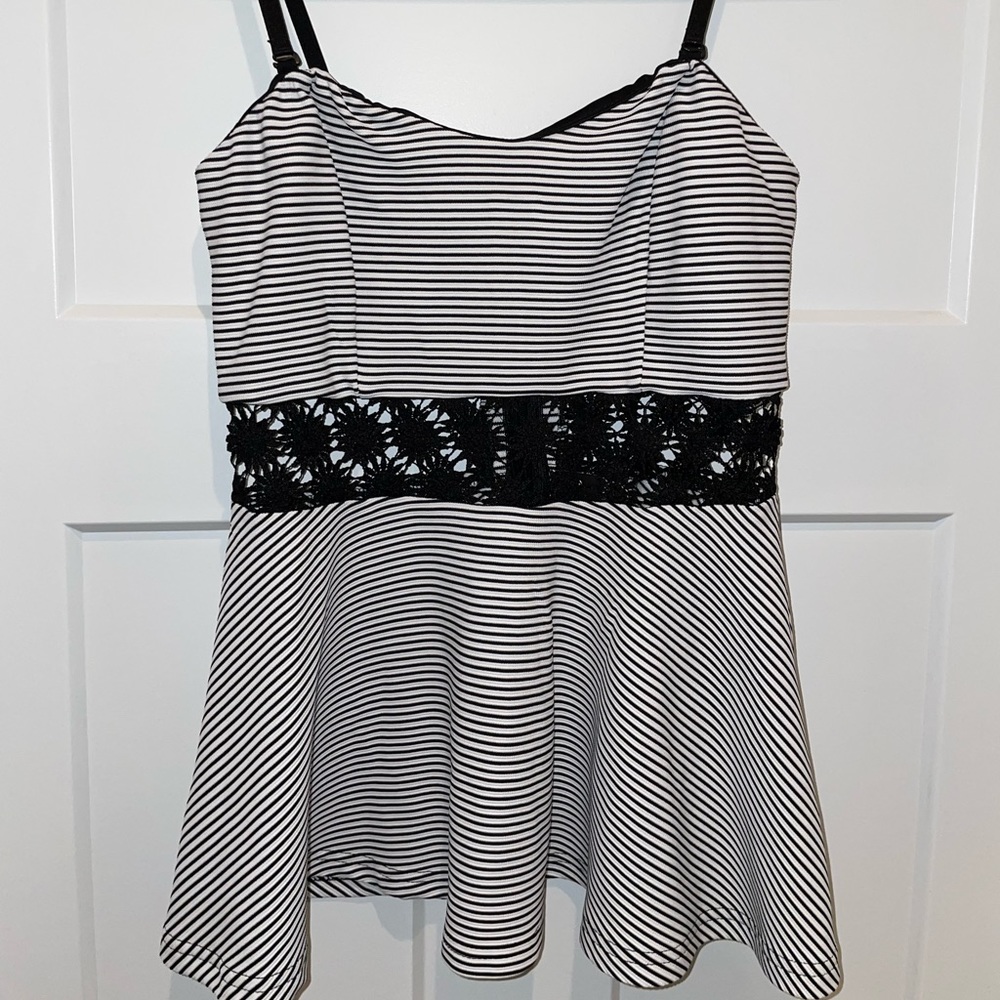 Size medium peplum black stripe top with removable and adjustable straps.